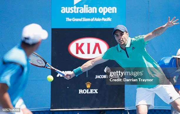 Jonathan Erlich of Israel and Colin Fleming of Great Britain compete in their first round match against Robin Haase of the Netherlands and Fernando...