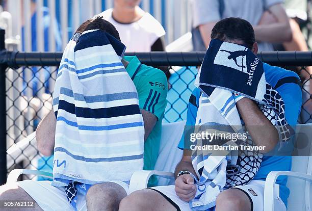 Jonathan Erlich of Israel and Colin Fleming of Great Britain in between games in their first round match against Robin Haase of the Netherlands and...