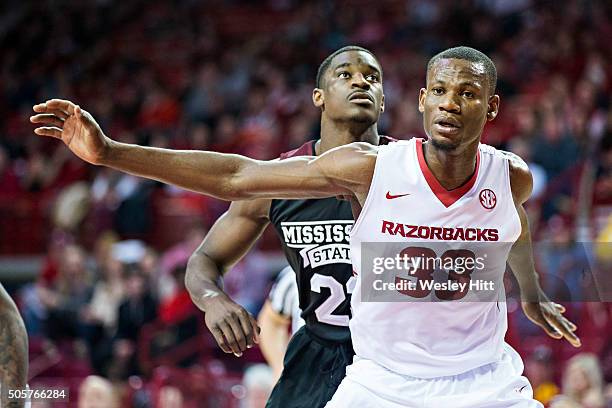 Moses Kingsley of the Arkansas Razorbacks blocks out Travis Daniels of the Mississippi State Bulldogs at Bud Walton Arena on January 9, 2016 in...