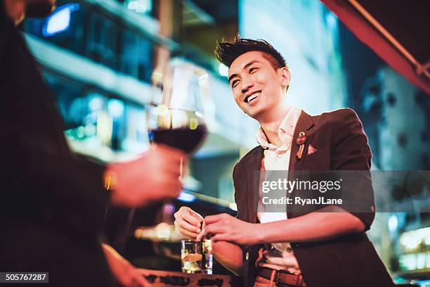 men drinking in hong kong - nightlife stock pictures, royalty-free photos & images