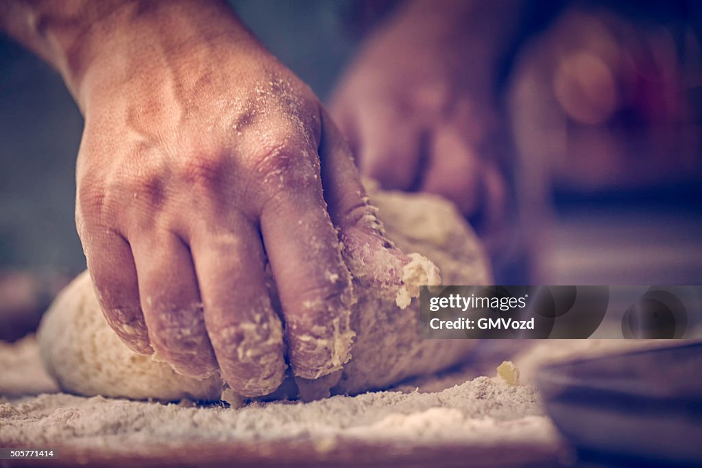 Kneading Dough with Hands On the Table