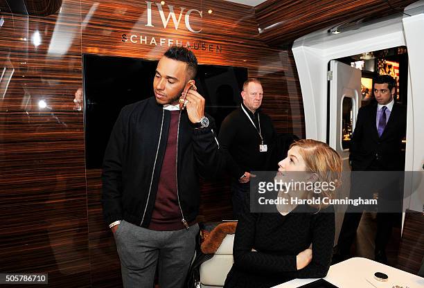 Lewis Hamilton and Rosamund Pike visit the IWC booth during the launch of the Pilot's Watches Novelties from the Swiss luxury watch manufacturer IWC...