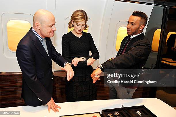 Schaffhausen CEO Georges Kern, Rosamund Pike and Lewis Hamilton visit the IWC booth during the launch of the Pilot's Watches Novelties from the Swiss...