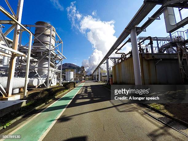 geothermal plant in a blue sky day - beppu bildbanksfoton och bilder