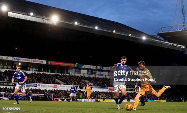 Joe Garner of Preston North End shoots under pressure from Tommy Smith of Ipswich Town during the Sky Bet Championship match between Ipswich Town and...