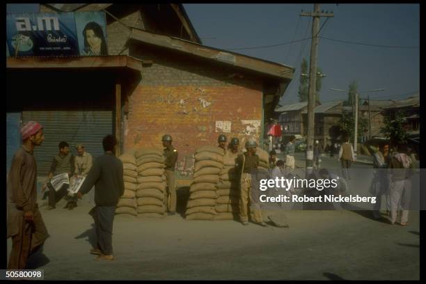 Members of non-Kashmiri CRPFCentral Reserve Police Force, behind sandbags, re problems w. Kashmiri separatist movement.