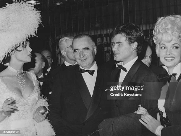 French Prime Minister Georges Pompidou meeting film stars Elsa Martinelli , Horst Buchholz and Nadja Tiller at an artists gala at the Cirque d'Hiver...