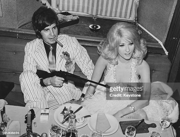 Italian actress Antonella Lualdi with her husband Franco Interlenghi in costume at a gangster party in Cortina, February 1968.