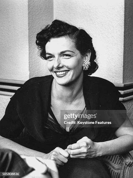 Portrait of actress Jane Russell smiling, pictured at a press reception as she prepares to make her stage debut at the Prince Charles Theatre,...