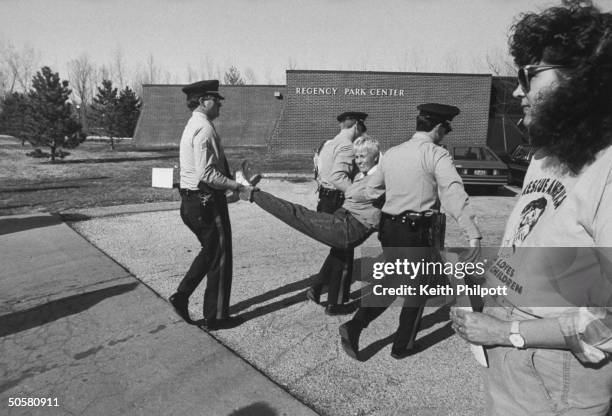 Anti-abortion activist Carol Armstrong being carried by 3 unident. Police officers when the group she works w., The Pro-Life Direct Action League,...