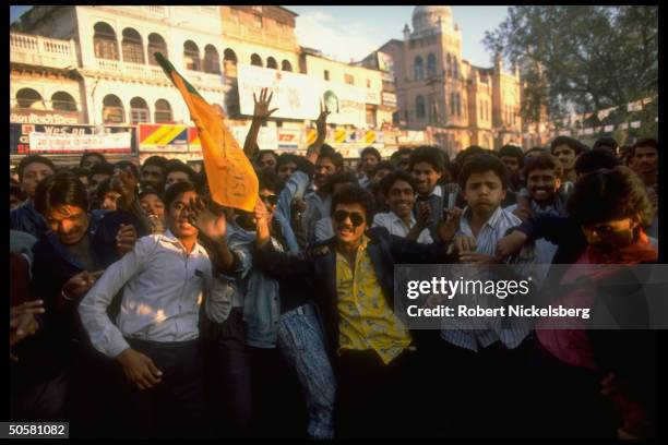 Jubilant youthful supporters of Bharatiya Janata Party during final day of BJP assembly election campaign; Gwalior, Madhya Pradesh State, India.