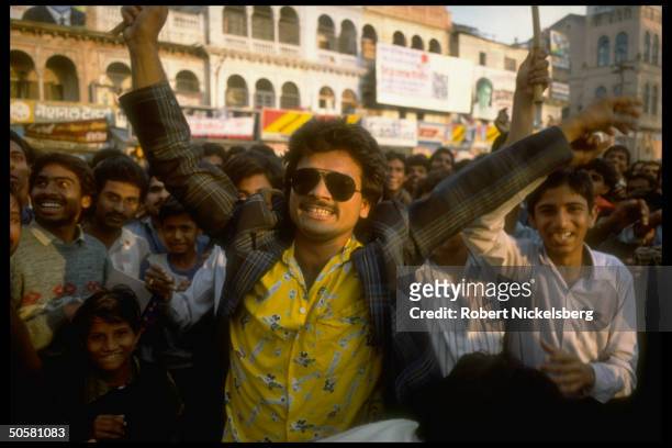 Jubilant youthful supporters of Bharatiya Janata Party during final day of BJP assembly election campaign; Gwalior, Madhya Pradesh State, India.