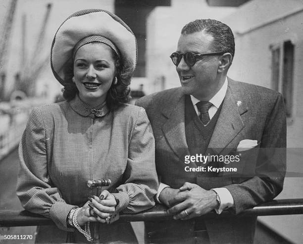 Actress Eleanor Parker and her husband, film producer Bert E Friedlob, pictured on the deck of the SS Queen Elizabeth leaving Southampton, June 9th...