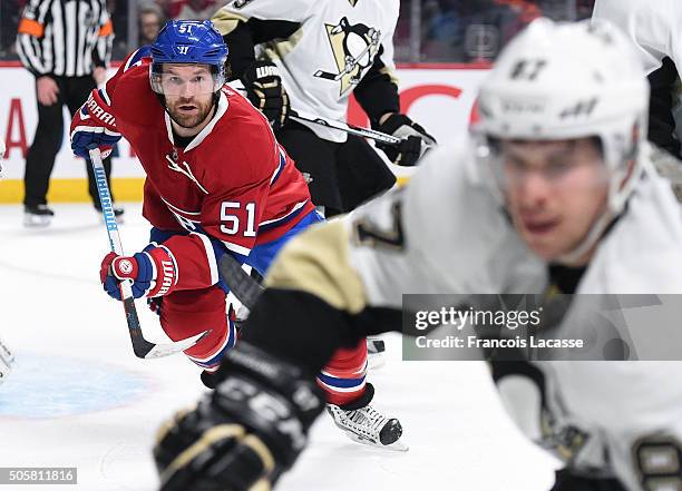 David Desharnais of the Montreal Canadiens and Sidney Crosby of the Pittsburgh Penguins battle for the puck in the NHL game at the Bell Centre on...