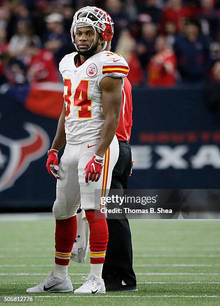 Knile Davis of the Kansas City Chiefs rest during a TV timeout agains the Houston Texans during the AFC Wild Card Playoff game at NRG Stadium on...