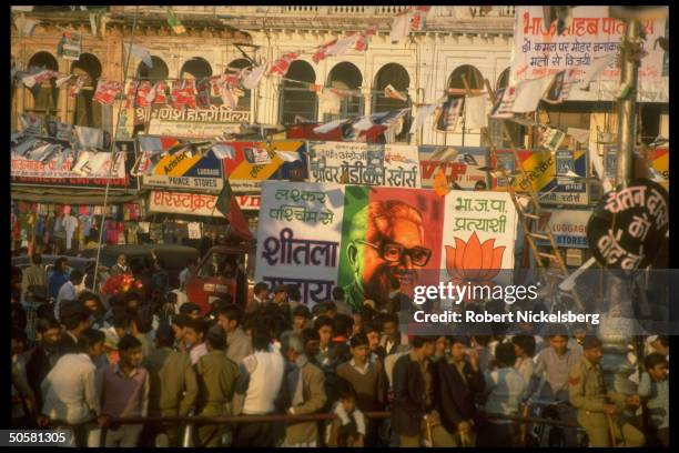 Bharatiya Janata Party campaign vehicle inching along pedestrian crowded road on final day of BJP assembly election campaign; Gwalior, Madhya Pradesh...