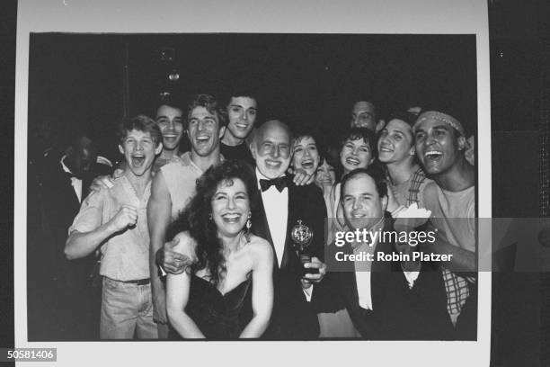Director/choreographer Jerome Robbins surrounded by the co. Of Jerome Robbins' Broadway, including singer Debbie Shapiro and actor Jason Alexander at...