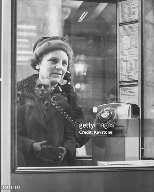 Politician Mervyn Pike, Assistant Postmaster General, pictured using one of the new telephone kiosks, near the Royal Exchange in London, January 29th...