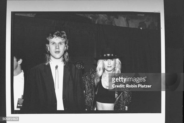 Blind guitarist Jeff Healey standing next to Lita Ford, guitarist for the rock group Ladykiller at the first annual Int'l Rock Awards ceremony.
