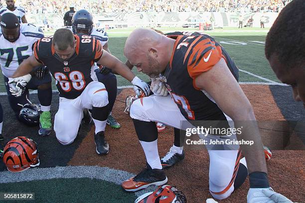 Kevin Zeitler and Andrew Whitworth of the Cincinnati Bengals share a moment in prayer after their game against the Seattle Seahawks at Paul Brown...