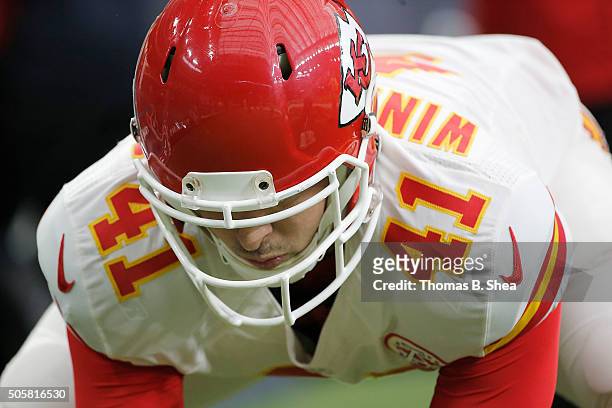 James Winchester of the Kansas City Chiefs practices hiking the ball on the sidelines while the Chiefs play the Houston Texans during the AFC Wild...