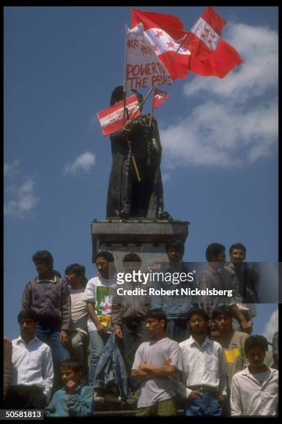 Pro-democracy youths by statue of King Mahindra hung w.power to people, Cong. & Communist party flags, re lifting of ban on multi-party politics.