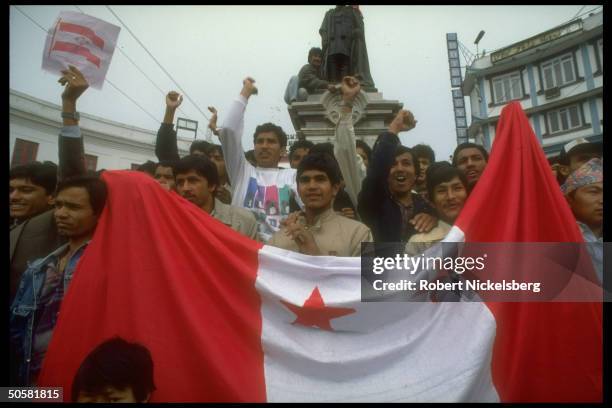 Pro-democracy protestors w. Opposition Congress Party flag by statue of ex-PM Rana Sham Sher after lifting of ban on multi-party politics.