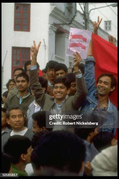 Pro-democracy protestors w. Congress Party flags & tikka smeared faces after lifting of ban on multiparty politics.