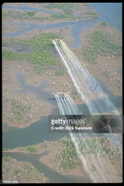 Planes flying over delta area to spray defoliant Agent Orange. 20 mi SE of Saigon.