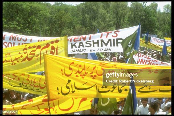 Jamaate-Islami Party supporters at anti-Indian, pro-Kashmiri independence rally replete w. Banners & flags.