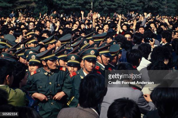 Chinese police block a student-led, pro-democracy march, Beijing, China, April 27, 1989.
