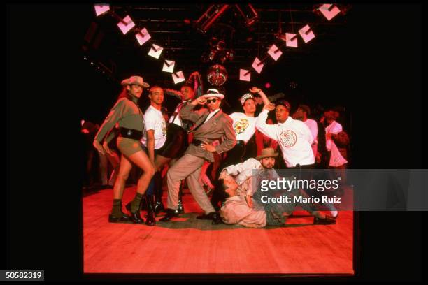 Voguers, members of House of Extravaganza group, all male, strike poses at Tracks, a nightclub; in voguing dancers strike campy poses ala VOGUE mag.