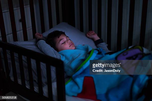 good night: young boy sleeping in bed - boy asleep in bed bildbanksfoton och bilder
