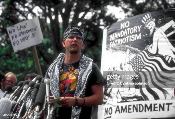 Gregory Joey Johnson, defendant in flag burning case, speaking against constitutional amendment banning flag desecration, outside Capitol.