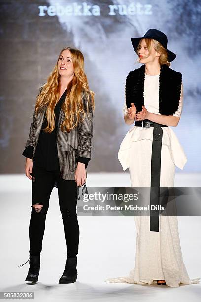 Designer Rebekka Ruetz walks with Larissa Marolt following her show during the Mercedes-Benz Fashion Week Berlin Autumn/Winter 2016 at Brandenburg...