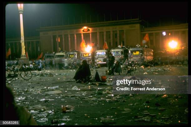 Night shot of part. Empty Tiananmen Sq. Strewn w. Garbage during pro-democracy protests there.