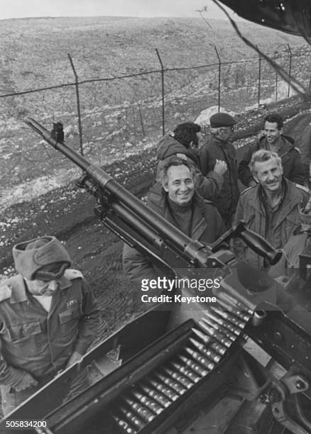 Israeli Minister of Defense Shimon Peres inspecting a gun emplacement during his tour of Israeli defenses along the northern border of Lebanon,...