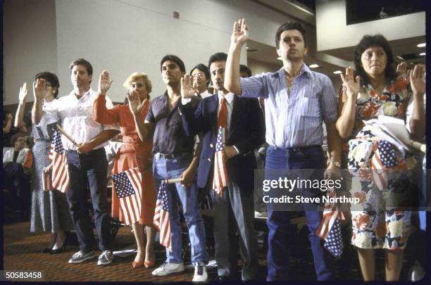 New citizens participating in swear-in ceremony during Constitutional Bicentennial fete.