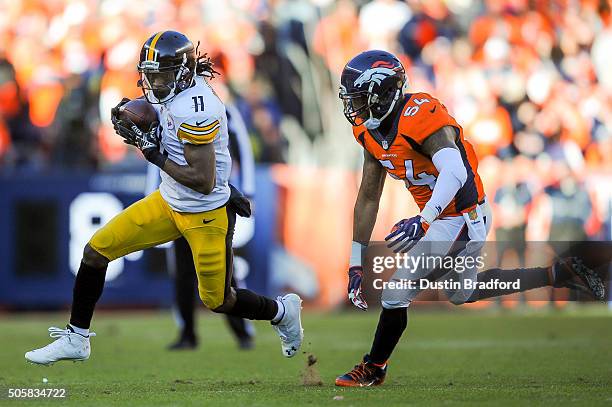 Markus Wheaton of the Pittsburgh Steelers runs after a reception as Brandon Marshall of the Denver Broncos pursues him during the AFC Divisional...