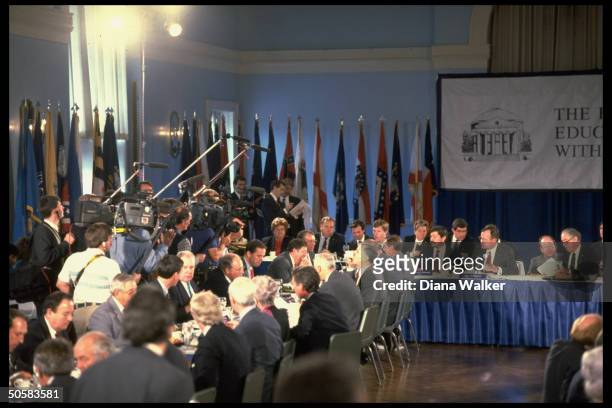 Pres. Bush at education summit, w. Educ. Secy. Cavazos , Gov. Branstad & group of aides & Govs. Seated at table in fore, University of Charlotte, VA.