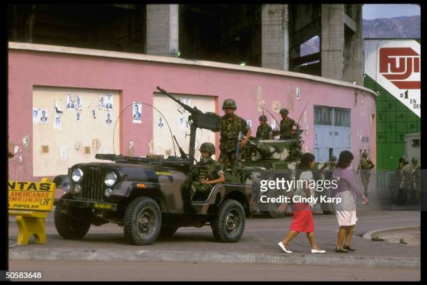Troops on patrol during surge of anti-Americanism after US kidnapping of drug king Juan Ramon Matta Ballesteros to stand trial in US.