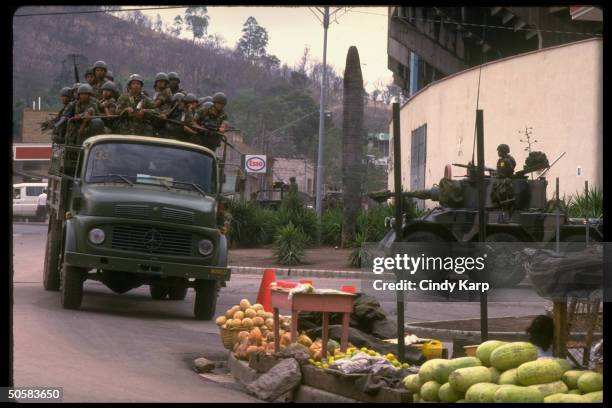 Troops on patrol during surge of anti-Americanism after US kidnapping of drug king Juan Ramon Matta Ballesteros to stand trial in US.