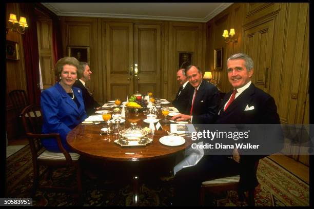 Thatcher & her secy. Powell breakfasting w. Pres. Bush , NSC Adviser Scowcroft & unident. At 10 Downing St. During NATO summit.