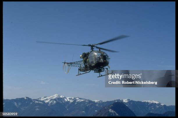 Pakistani mil. Helicopter flying over disputed Kashmir area, approaching Jura Valley, nr. Troubled Srinagar area.