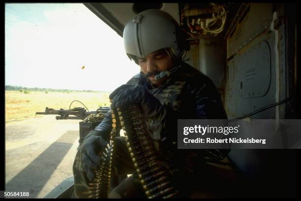 Helicopter gunship gunner at his post as Colombo govt. Forces battle Liberation Tigers of Tamil Eelam rebels for control of besieged Jaffna Fort.