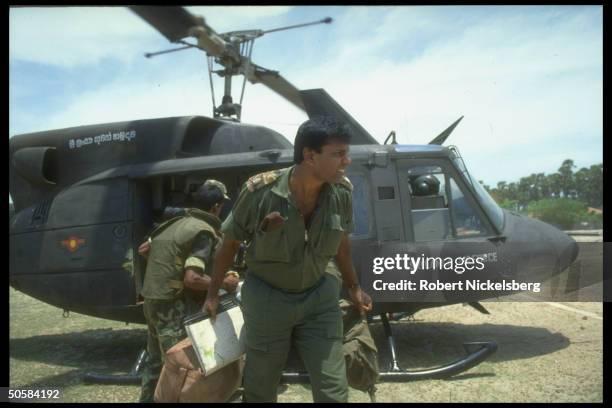 Soldier by Air Force helicopter as Colombo govt. Forces battle Liberation Tigers of Tamil Eelam rebels for control of besieged Jaffna Fort.