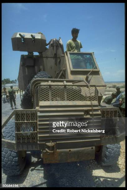 Troops in armored truck as Colombo govt. Forces battle Liberation Tigers of Tamil Eelam rebels for control of besieged Jaffna Fort.