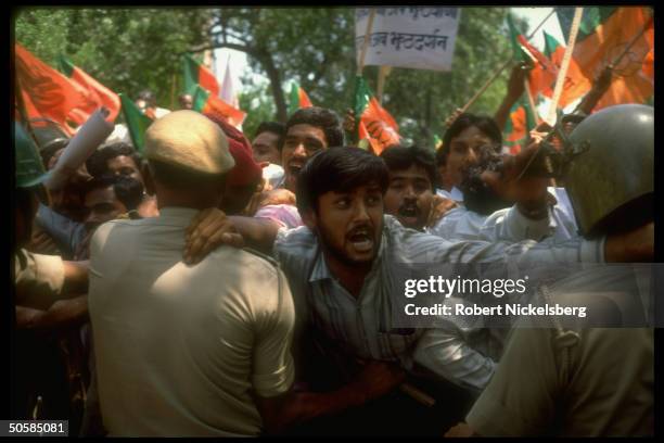 Police crackdown at militant Hindu anti-government rally.