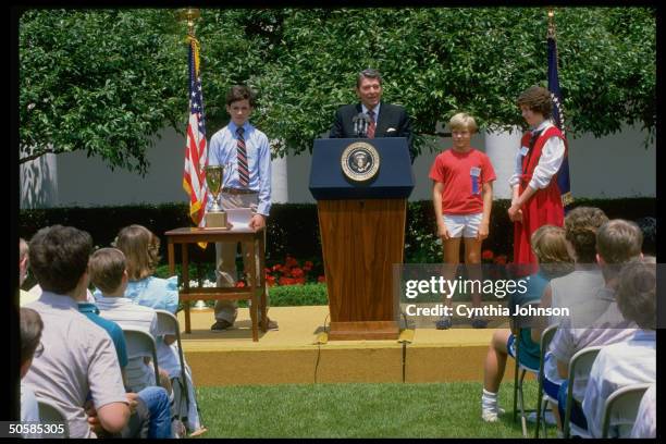 Pres. Reagan w. Natl. Spelling Bee winner Jon Pennington & runners-up Andy Larson & Rachel Henderson, at WH Rose Garden ceremony.