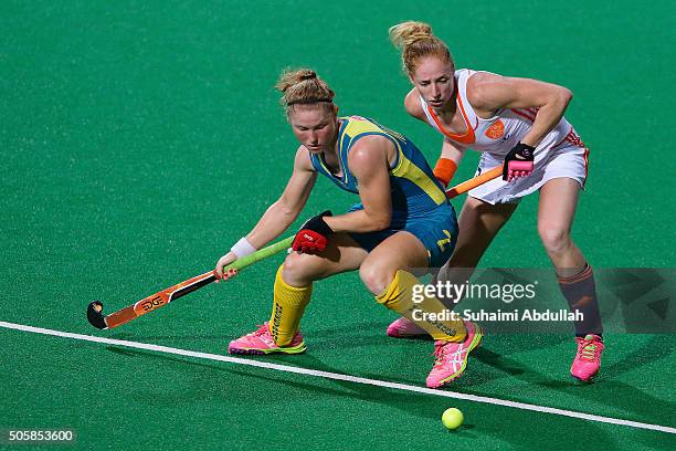 Margot van Geffen of Netherlands and Georgia Nanscawen of Australia compete for the ball during the TPG International Tri Series at Sengkang Hockey...